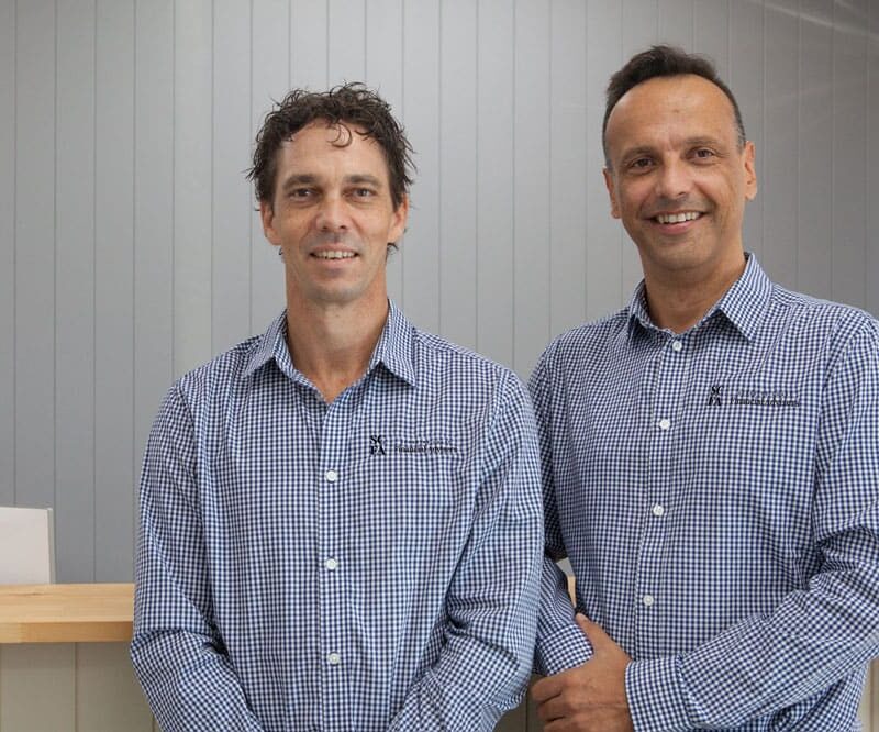 Two Financial Advisors Standing Next To Each Other — Financial Advisors in Maroochydore, QLD