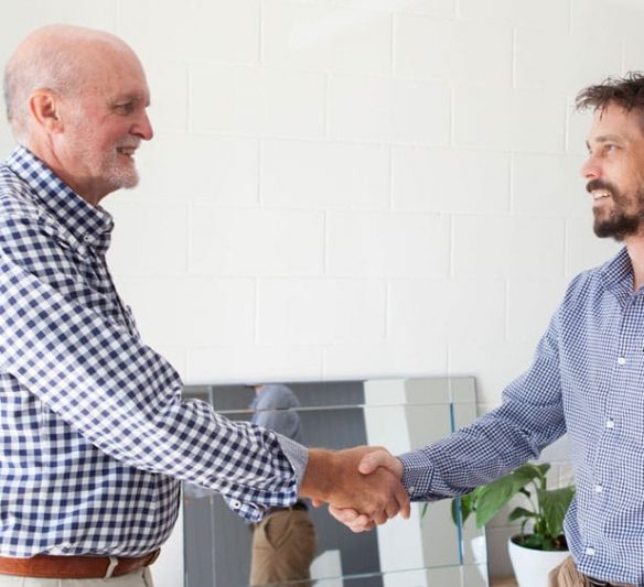 Two men shaking hands — Financial Advisors in Maroochydore, QLD