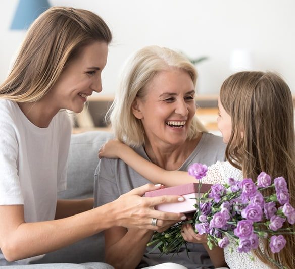 Happy Grandma Embracing Little Granddaughter — Financial Advisors in Maroochydore, QLD